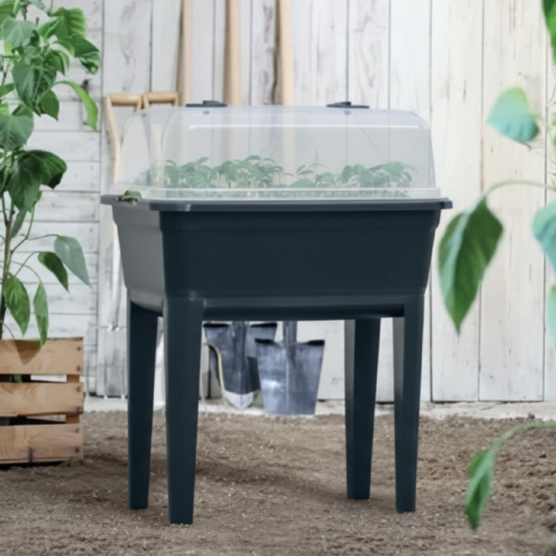 Huerta elevada Respana Eco de color antracita, mostrando su diseño rectangular sobre patas y su material sostenible de plástico reciclado. #ia - Tumatera.co